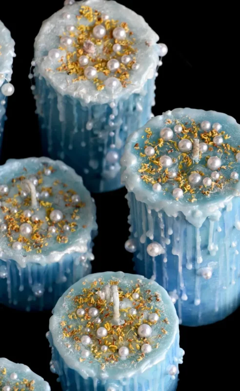ManoMade blue coral sea pearl candle closeup black background artisan candle