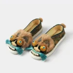 ManoMade brown gold lion hand-embroidered silk slippers closeup detail
