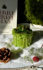 ManoMade enchanted emerald mini pomelo candle snowy Christmas display artisan candle