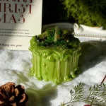 ManoMade enchanted emerald mini pomelo candle snowy Christmas display artisan candle