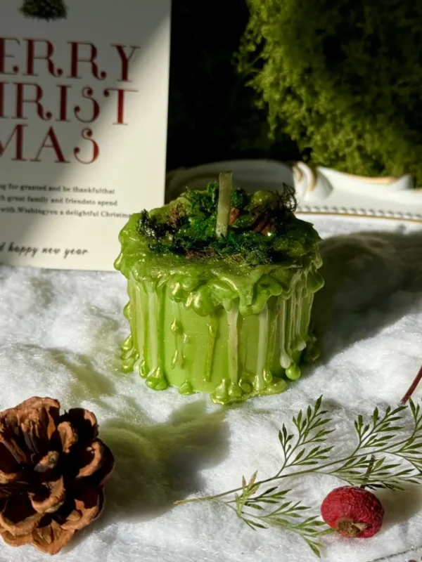 ManoMade enchanted emerald mini pomelo candle snowy Christmas display artisan candle