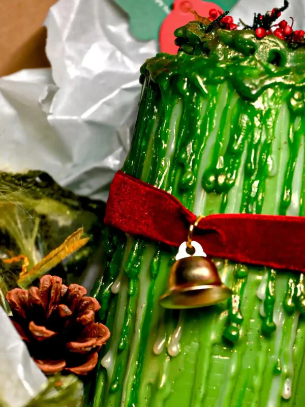 ManoMade enchanted emerald pomelo candle on snow Christmas setup artisan candle