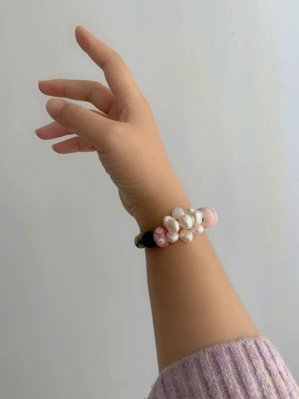 MANOMADE Peach Gummy handmade pink pearl gemstone bracelet, lifestyle view