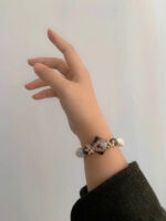 MANOMADE Wild Grass and Vines handmade green gemstone freshwater pearl bracelet, wrist wearing view